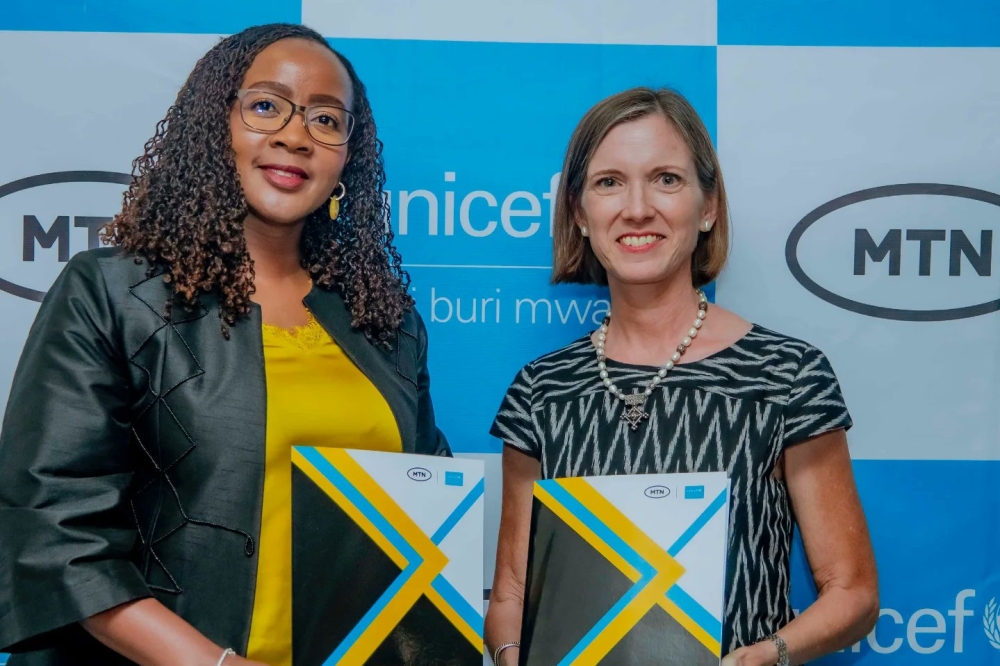 MTN Rwanda CEO Mapula Bodipe and UNICEF Country Representative Julianna Lindsey during the signing of the agreement at MTN’s headquarters in Kigali on December 12. Courtesy