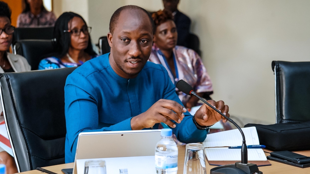 Minister of Infrastructure Jimmy Gasore addresses members of the National Consultative Forum of Political Organisations  during  a general assembly on Thursday, December 19. Courtesy