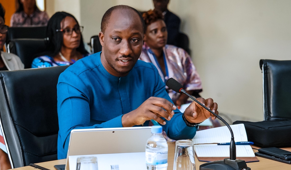 Minister of Infrastructure Jimmy Gasore addresses members of the National Consultative Forum of Political Organisations  during  a general assembly on Thursday, December 19. Courtesy