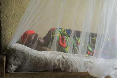 A woman photographed while sleeping in mosquito net during the awareness campaign on Malaria prevention in Bugesera District. File