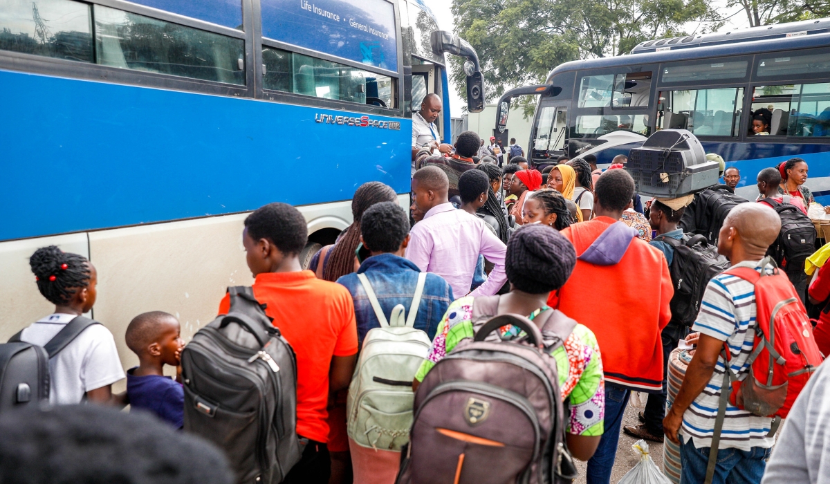 Long lines formed at Kigali Pele stadium as thousands of travellers turned up to board buses to join their families upcountry for festive season celebrations, on Tuesday, December 24. Photo by Craish Bahizi