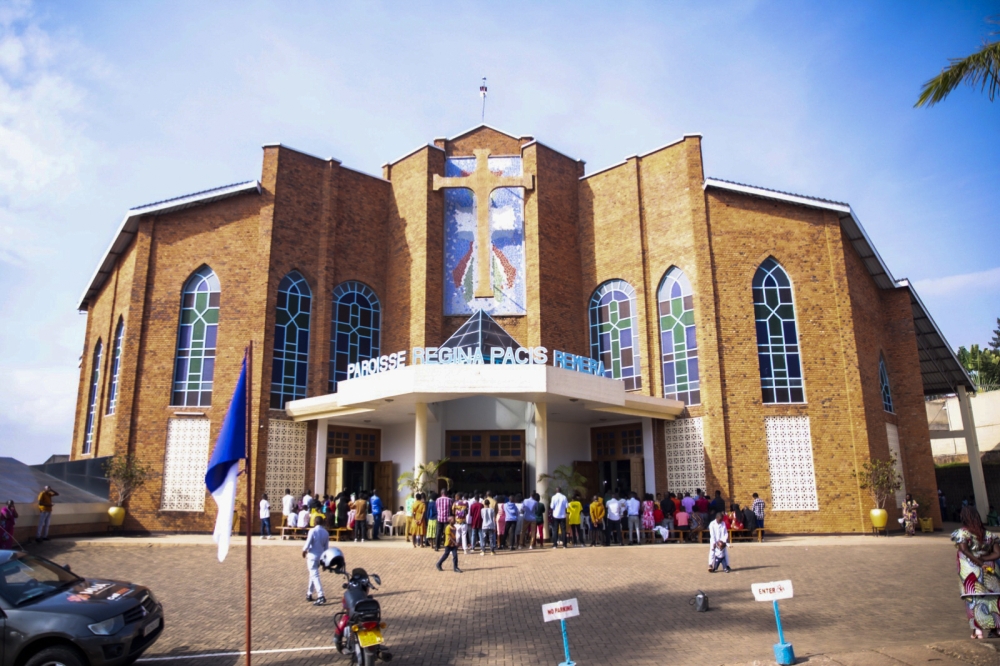 Christians attend the Holy Communion mass at Regina Pacis catholic church in Remera on Christmas. Photo by Emmanuel Dushimimana