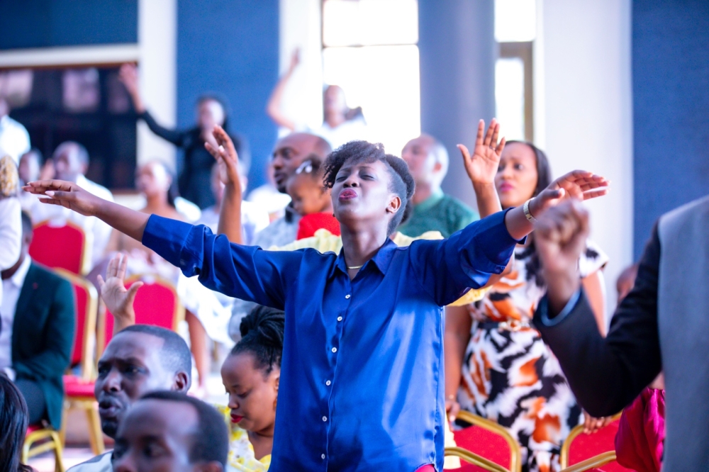 Believers during a praise and worship session at Evangelical Restoration Church (Masoro) on Christmas. All photos by Emmanuel Dushimimana