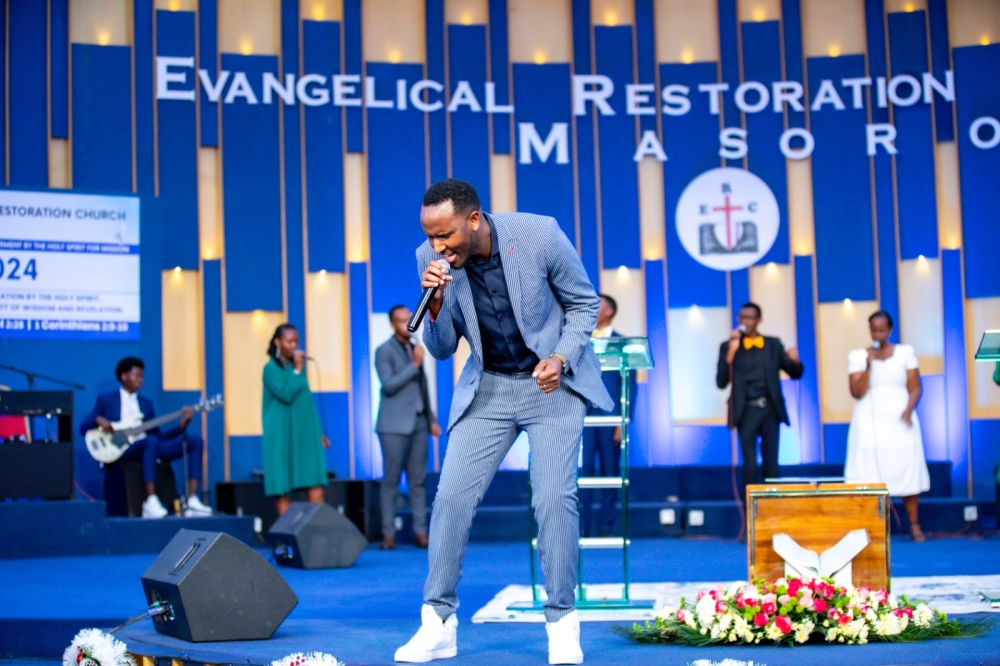 U.S-based gospel artiste Gentil Misigaro performs during Christmas service at 
Evangelical Restoration Church, Masoro in Kigali. All photos by Emmanuel Dushimimana