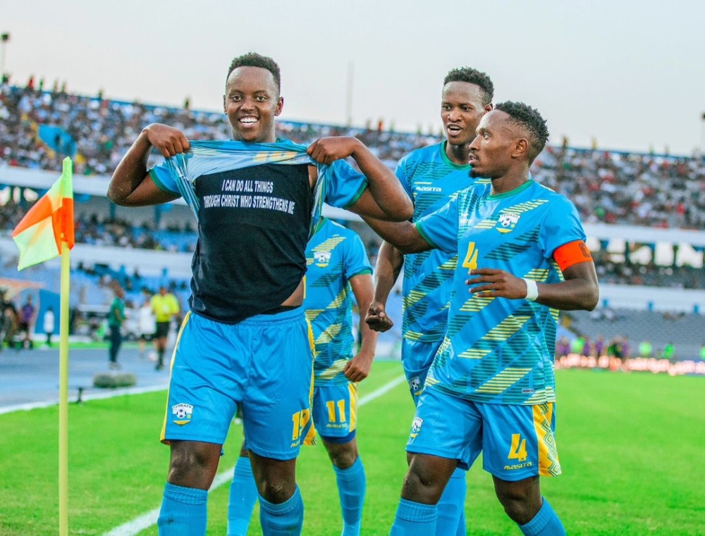 Nshuti celebrates his equalizer against Libya in Tripoli with skipper Djihad Bizimana and Omborenga Fitina.