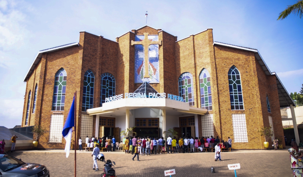 Christians attend the Holy Communion mass at Regina Pacis catholic church in Remera on Christmas. Photo by Emmanuel Dushimimana