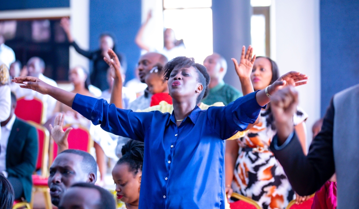 Believers during a praise and worship session at Evangelical Restoration Church (Masoro) on Christmas. All photos by Emmanuel Dushimimana