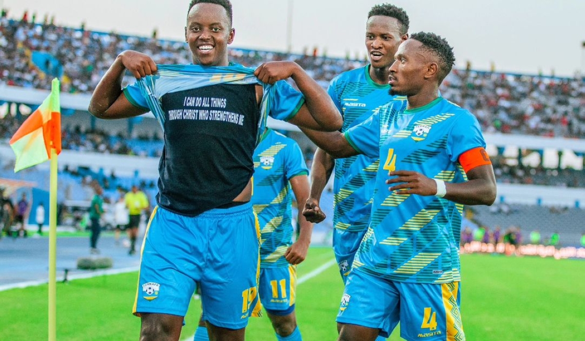 Nshuti celebrates his equalizer against Libya in Tripoli with skipper Djihad Bizimana and Omborenga Fitina.