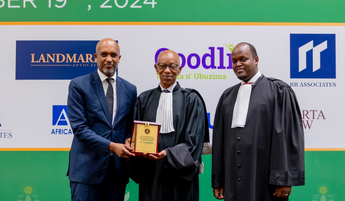 Justice Minister Emmanuel Ugirashebuja (left), and the President of Rwanda Bar Association, Moise Nkundabarashi (right) recognise Adv. Protais Mutembe (centre), for his outstanding contributions to the legal profession. COURTESY