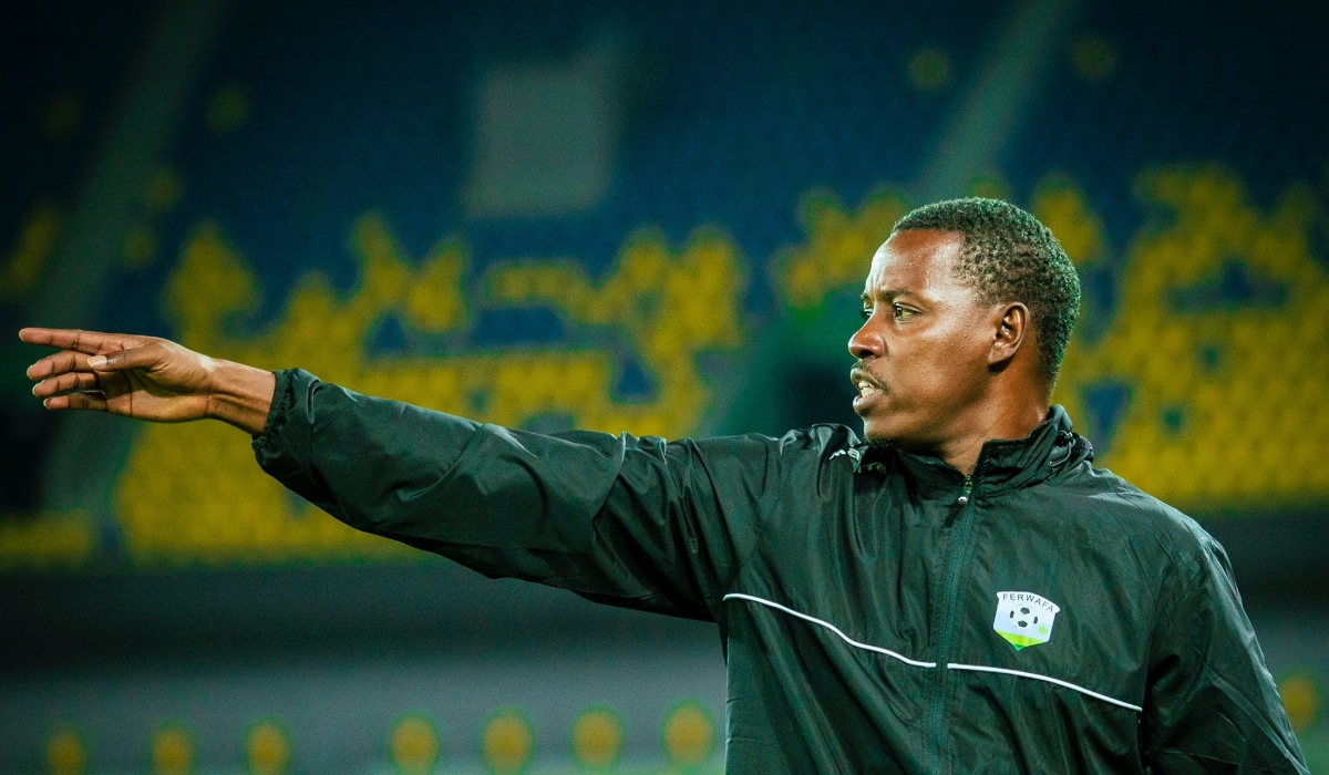 Rwanda caretaker coach Jimmy Mulisa inspects Amavubi training session at Amahoro Stadium.