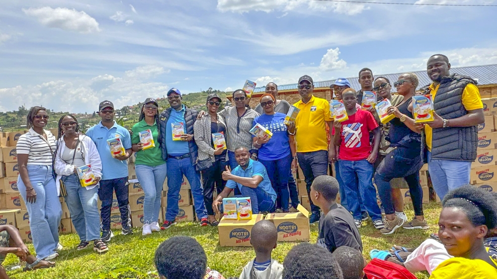 Members from the Rotary Club of Kigali Virunga pose for a photo at the event in Huye District, on December 28