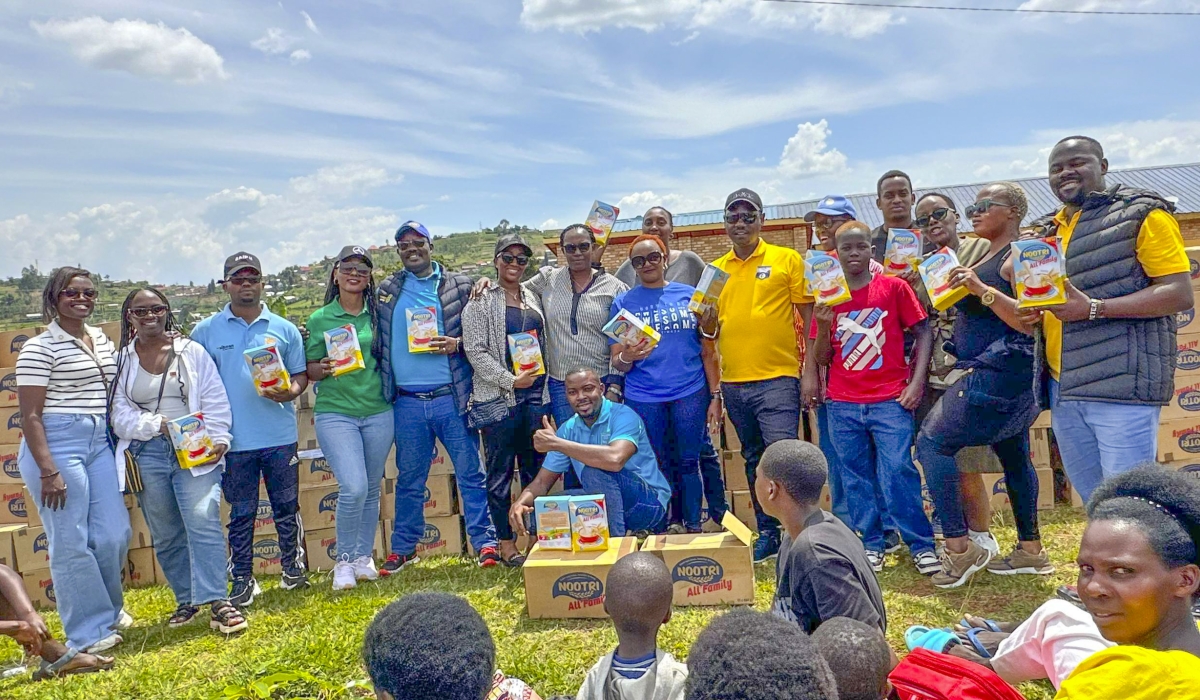 Members from the Rotary Club of Kigali Virunga pose for a photo at the event in Huye District, on December 28