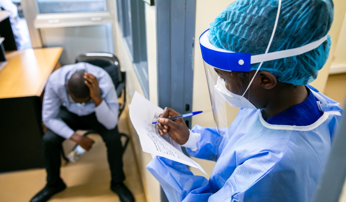 A medic records a patient&#039;s identification details during a medical drill focused on pandemic preparedness at King Faisal Hospital in 2022 . Photo by Olivier Mugwiza