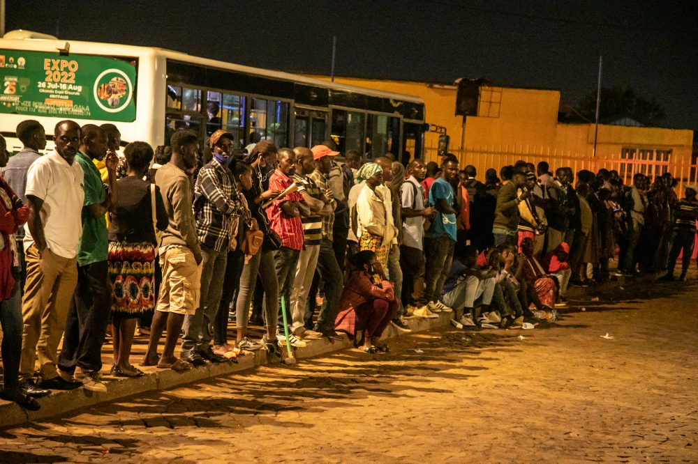 Passengers await for the buses at Kimironko taxi park. Public transport buses in Kigali will operate 24 hours a day starting from December 31, until January 5. Craish Bahizi