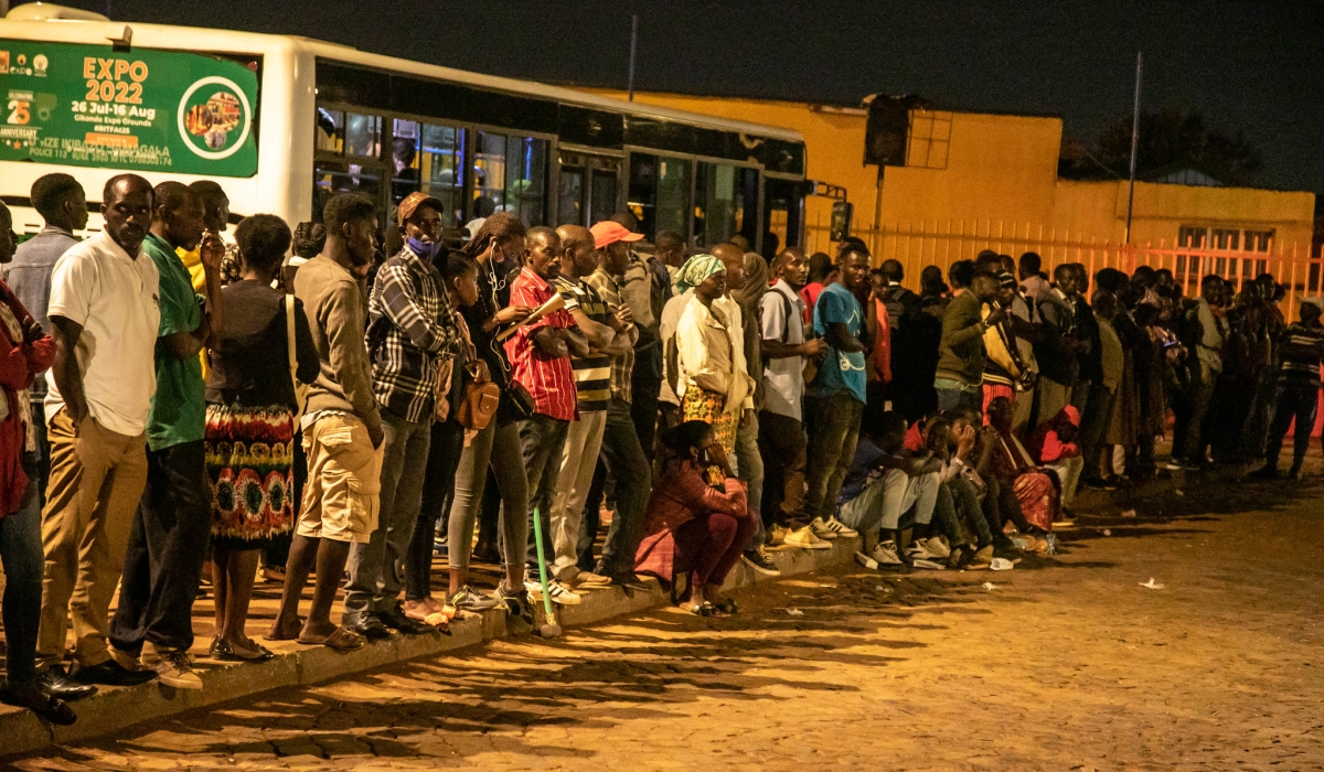 Passengers await for the buses at Kimironko taxi park. Public transport buses in Kigali will operate 24 hours a day starting from December 31, until January 5. Craish Bahizi