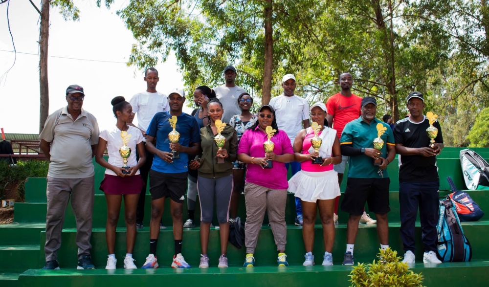 Winners at the tournament pose with their trophies. Courtesy