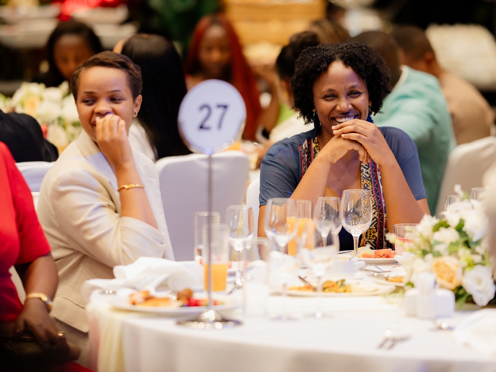 People follow a music band while performing at the gala dinner to celebrate the festive season at Kigali Convention Centre. Photo by Craish Bahizi.