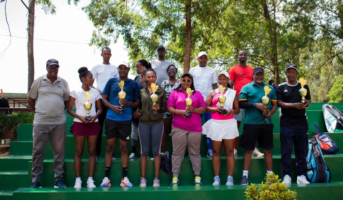 Winners at the tournament pose with their trophies. Courtesy