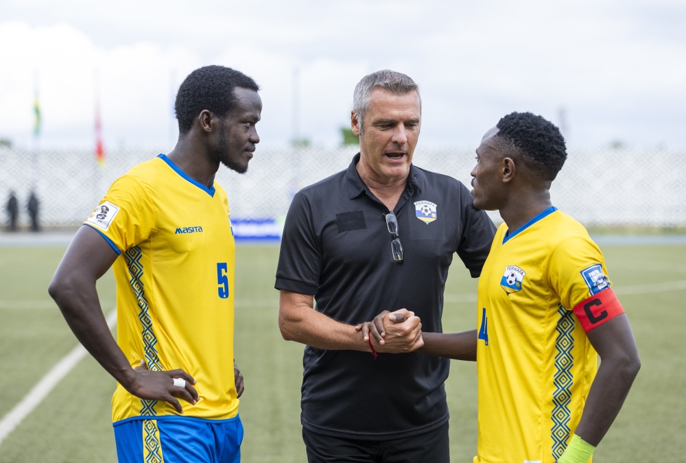 National team head caoch  German tactician Frank Spittler interacts with Djihad Bizimana and Ange Mutsinzi at Huye stadium in 2023. Olivier Mugwiza