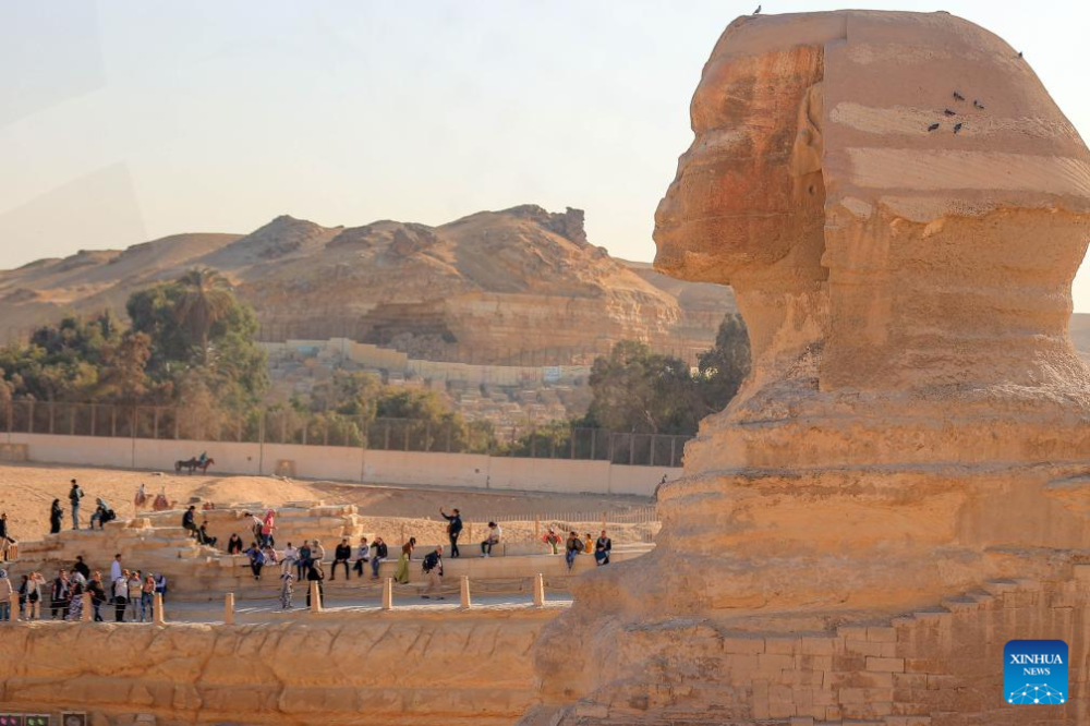 Tourists visit the Sphinx at the Giza Pyramids scenic spot in Giza, Egypt, on Jan. 2, 2025. Egyptian Prime Minister Mostafa Madbouly said Wednesday that the country received a record high of 15.7 million tourists in 2024, according to a statement issued by the Egyptian cabinet. (Xinhua/Ahmed Gomaa)