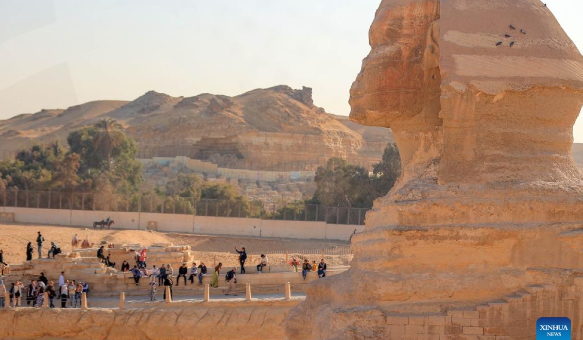 Tourists visit the Sphinx at the Giza Pyramids scenic spot in Giza, Egypt, on Jan. 2, 2025. Egyptian Prime Minister Mostafa Madbouly said Wednesday that the country received a record high of 15.7 million tourists in 2024, according to a statement issued by the Egyptian cabinet. (Xinhua/Ahmed Gomaa)