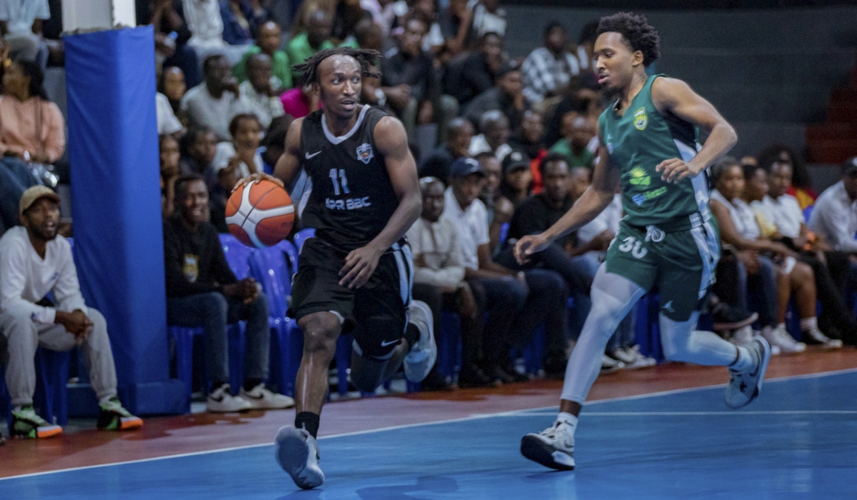 APR BBC&#039;s Nshobizwabyosenumukiza dribbles past Tigers&#039; player during the league game at BK Arena on September 21, 2024. Olivier Mugwiza