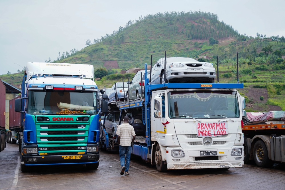 Cross-border trucks transport new cars and other goods from Dar-es-Salaam port to Rwanda, at Rusumo One-Stop Border Post in Kirehe
District. Photo by Craish Bahizi