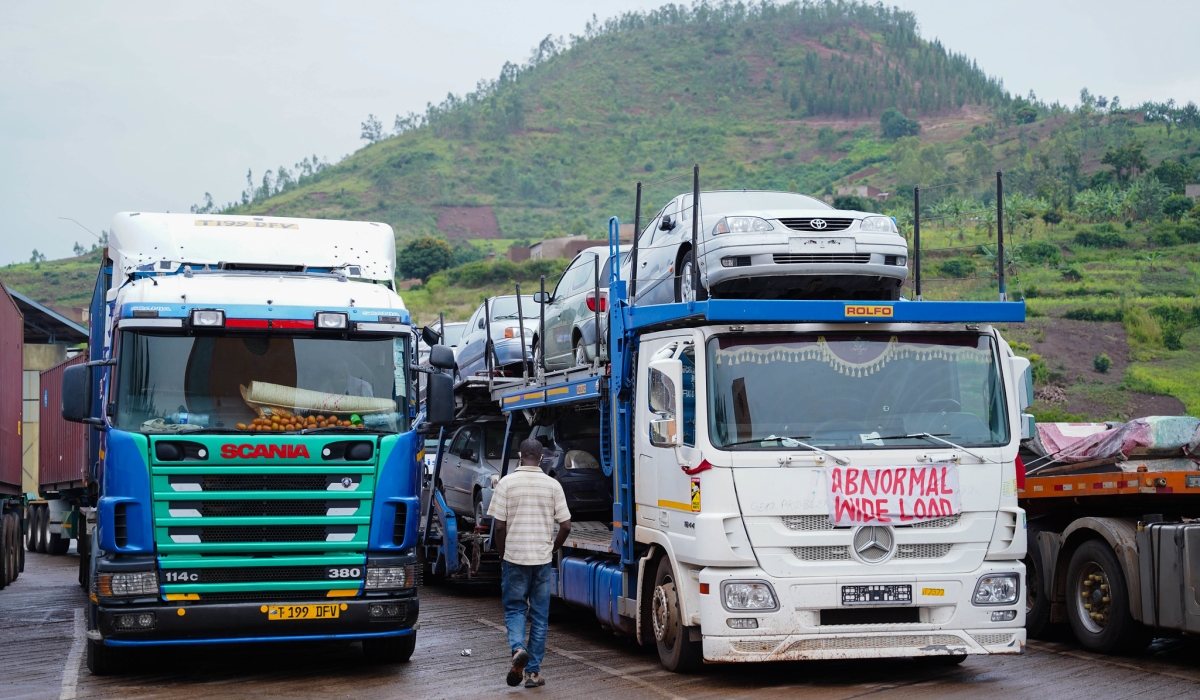 Cross-border trucks transport new cars and other goods from Dar-es-Salaam port to Rwanda, at Rusumo One-Stop Border Post in Kirehe
District. Photo by Craish Bahizi