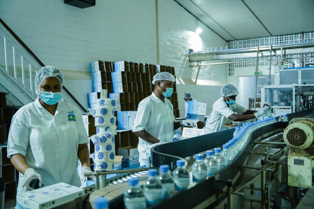 Workers on duty at Inyange Industries in Kigali. File