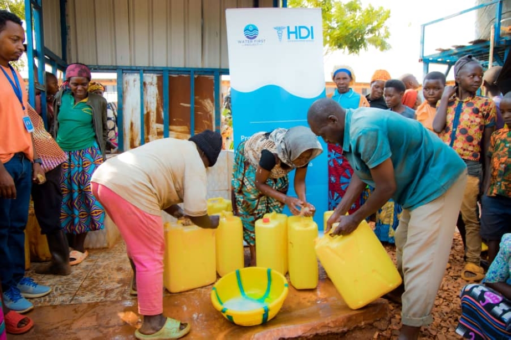 Beneficiaries draw water from a newly launched initiative by   the Water Fast project, Health Development Initiative in the Rweru Sector of Bugesera