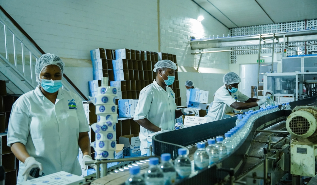 Workers on duty at Inyange Industries in Kigali. File