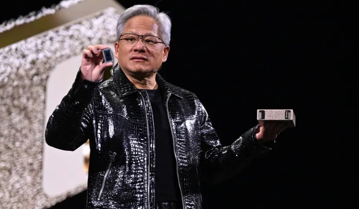 Nvidia CEO Jensen Huang holding the Project Digits computer onstage at CES 2025.