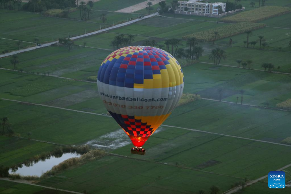 A hot air balloon flies over the west bank of Nile River in Luxor, Egypt, Jan. 9, 2025. Taking hot air balloon is a popular choice for tourists visiting the tourist city of Luxor. (Xinhua/Ahmed Gomaa)