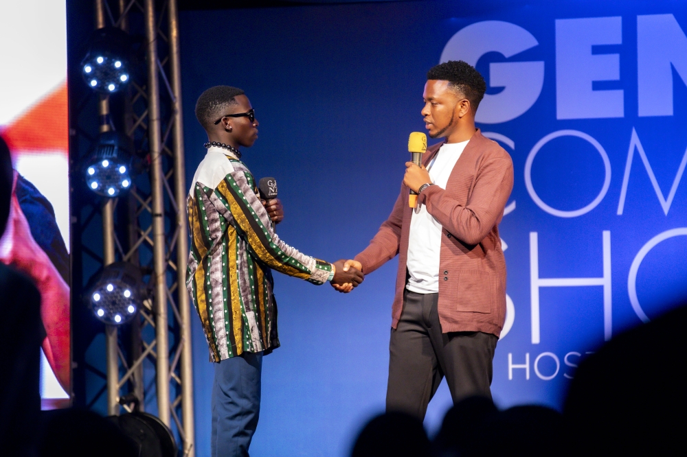 Fally Mercy, the organizer of Gen-Z Comedy, applauds one of the comedians on stage. All photos by Emmanuel Dushimimana