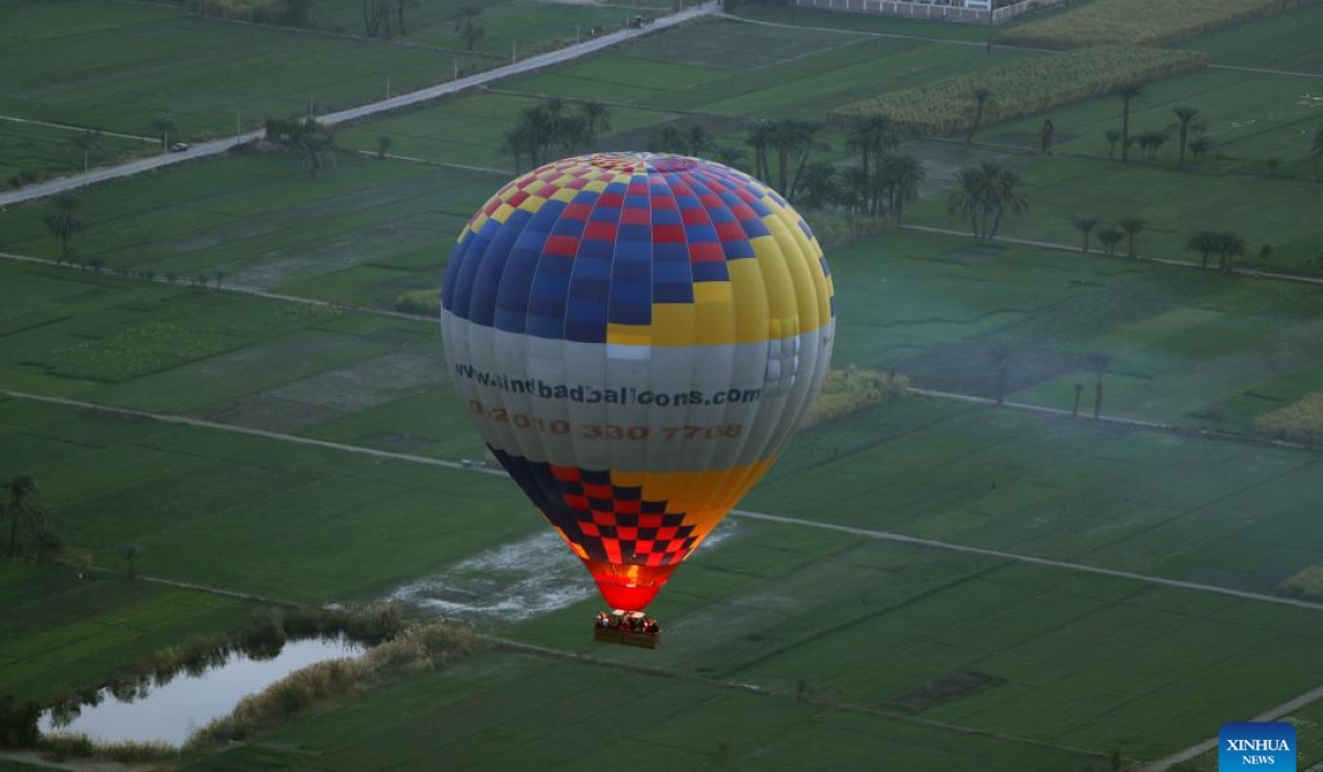 A hot air balloon flies over the west bank of Nile River in Luxor, Egypt, Jan. 9, 2025. Taking hot air balloon is a popular choice for tourists visiting the tourist city of Luxor. (Xinhua/Ahmed Gomaa)