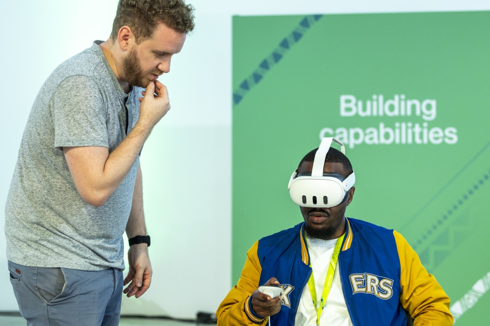 Delegates use  Virtual Reality (VR) technologies at BioNtech firm in Kigali Special Economic Zone in December 2023. Augmented reality (AR) and Virtual Reality (VR) fall under the umbrella of extended reality(XR) technologies. Photo by Olivier Mugwiza