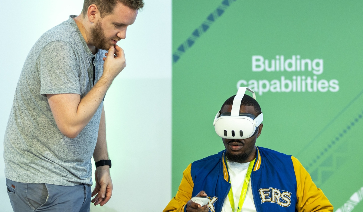 Delegates use  Virtual Reality (VR) technologies at BioNtech firm in Kigali Special Economic Zone in December 2023. Augmented reality (AR) and Virtual Reality (VR) fall under the umbrella of extended reality(XR) technologies. Photo by Olivier Mugwiza