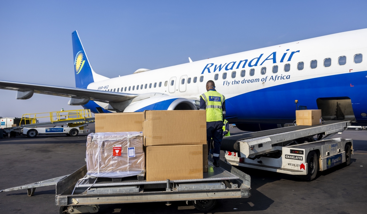 Workers load a consolidated consignment of various agricultural products for export at Kigali International Airport in October 2024. Photo by Olivier Mugwiza.