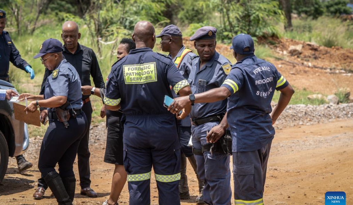 Police officers and forensic pathology service members work during a rescue operation at an abandoned gold mine in Stilfontein, North West Province, South Africa, on Jan. 13, 2025. (Photo by Shiraaz Mohamed/Xinhua)