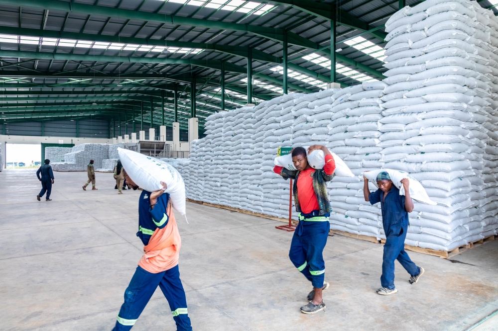 Workers carry packages at Rwanda Fertilizer Company in Bugesera. Foreign Private Capital (FPC) inflows into Rwanda increased by 33.8 per cent to $886.9 million (approx. Rwf1.2 trillion) in 2023. CRAISH BAHIZI