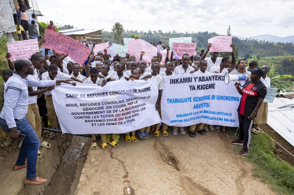 Congolese refugees from Kigeme refugee camp, march during a peaceful demonstration to call for action against the ongoing atrocities against Tutsi in eastern DR Congo on March 8, 2024. Olivier Mugwiza