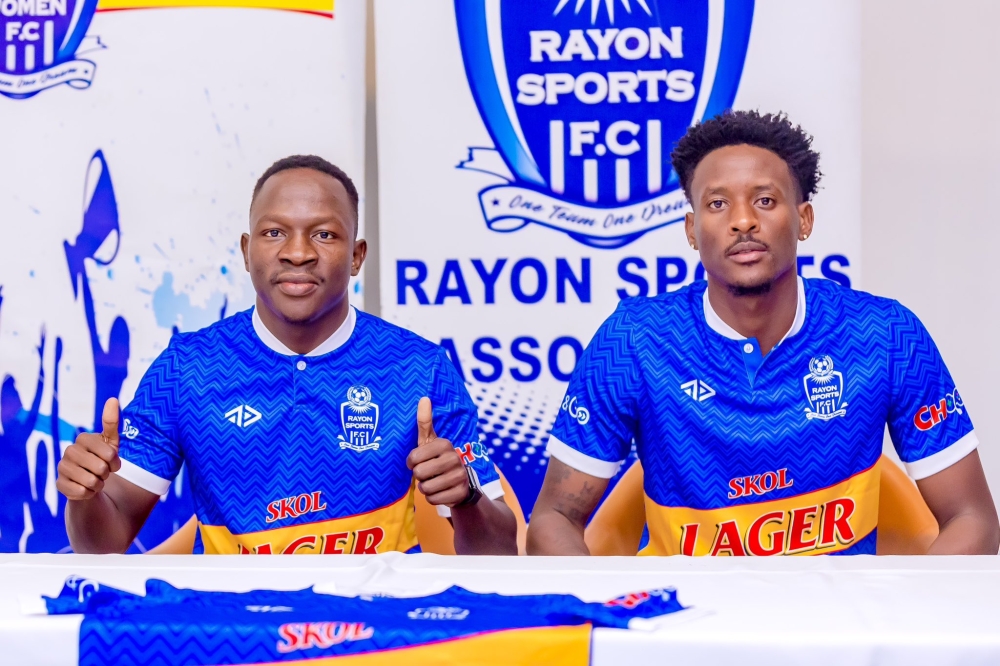 Assana (left) and Biramahire (right) after they signed the contract 