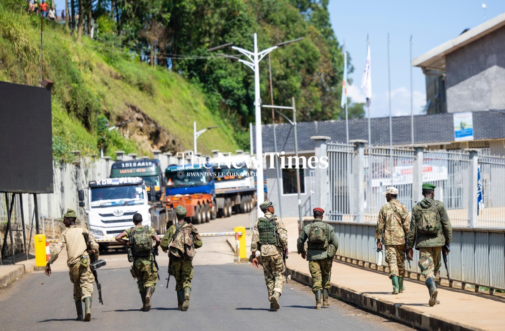 AFCM23 fighters walk back to the DR Congo side of the border soom after their brief show up at Rusizi 1 Border Post, on Sunday, February 16.