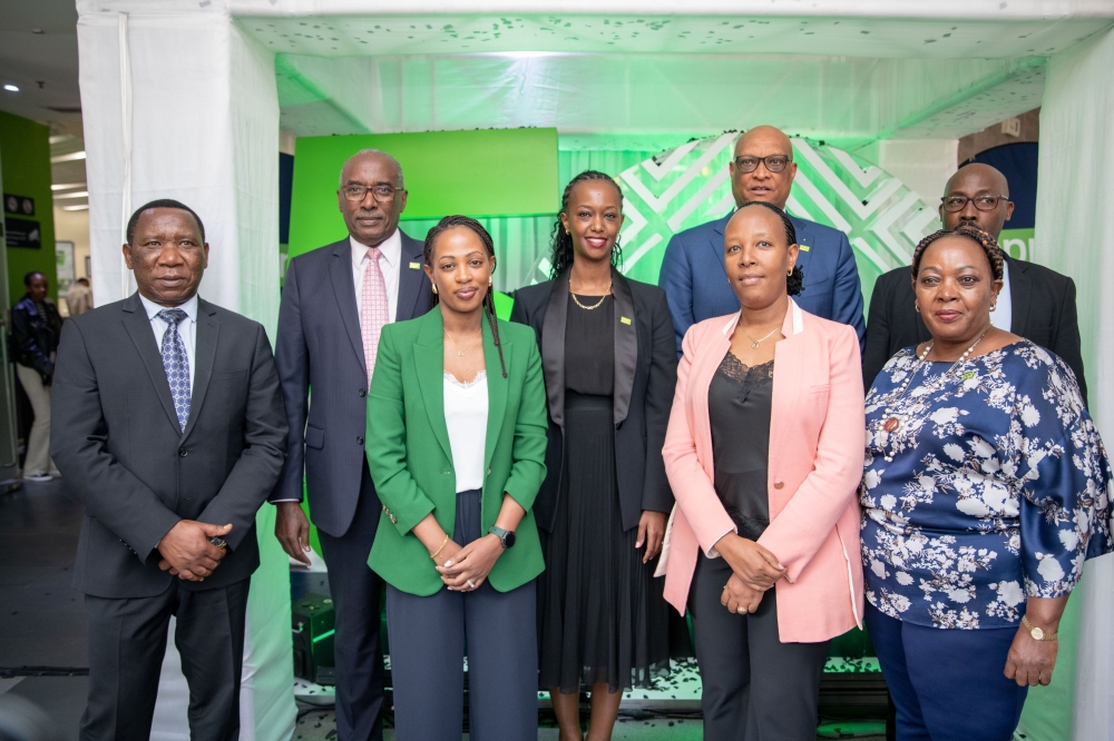 Officials pose for a group photo  after touring the newly inaugurated platinum branch at the bank’s headquarters in Kigali. Courtesy