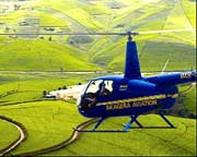 One of the Akagera Aviation choppers flying over a tea plantation in Rwanda. The company is eyeing to transport Chogm delegates in Uganda. (Courtesy Photo)