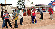 Youths stand at road junctions waiting to board construction trucks ferrying stones, sand or timber. (Photo/ G. Kagame)