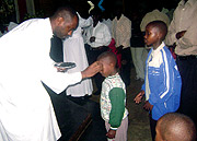 A child receiving ashes on Ash Wednesday at St. Michaelu2019s Cathedral, Kigali. (Photo / J. Kafuuma)