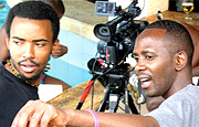 IN ACTION: Ndahayo (R) directing a scene from his short film u201cScars of Silveru201d in Uganda. (Photo / A. Boghani).