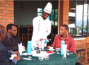 Smartly clad waiters and chefs doing their thing.