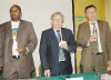 L-R: CESTRAR Secretary General Eric Manzi, Prof Bernd Tenckhoff and Rik Desmet lit candles in memory of workers who died in duty related accidents. (Photo/J Mbanda)